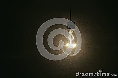 Light bulb on dark background Stock Photo