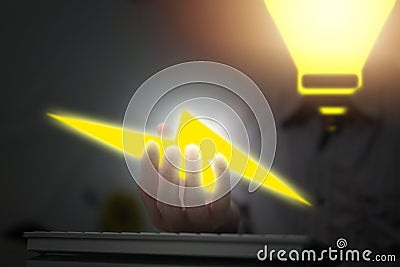 Light bulb head person hold lighting in hand for electricity use in future concept Stock Photo