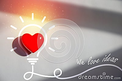 A light bulb with a heart as inspiration and an ideas concept Stock Photo