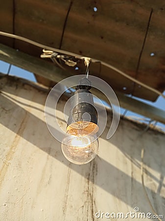 Light bulb turned on at Day Time Stock Photo