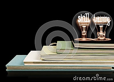 Light Bulbs and Books with Skill Training Concept Stock Photo