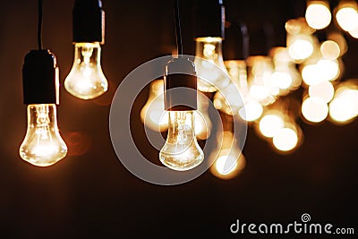 Light bulbs over dark texture Stock Photo