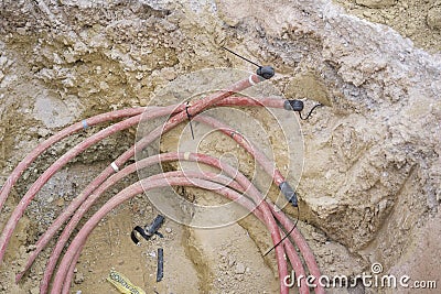 Light cables in a construction ditch Stock Photo