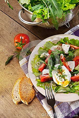 Fresh lidht salad with poached egg Stock Photo
