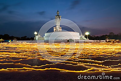 Light candle with buddha image at twilight Stock Photo