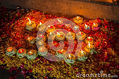 light candle and flower& x27;s decorate of OM is symbol of hindu reli Stock Photo