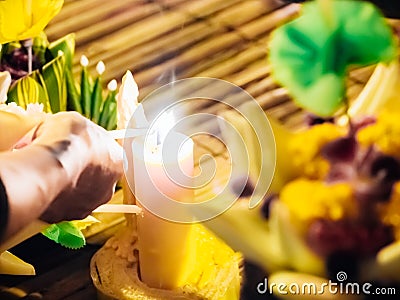 Light the candle by man hand for pray from loykratong festival a Stock Photo