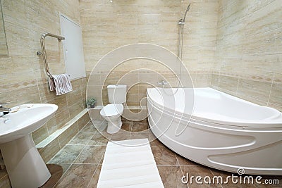Light and clean bathroom with toilet with tiles on floor Stock Photo