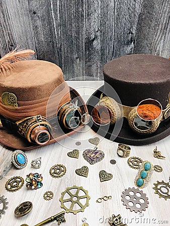 light & dark brown steampunk hats, with goggles, gears, magnifying glass, spectacle Stock Photo