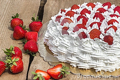 Light, delicate and tasty cream cake with fresh strawberries (half cake) Stock Photo