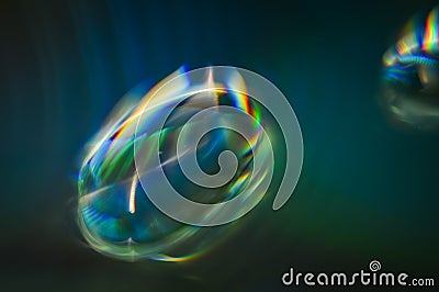 Light diffraction showing rainbows on water drops Stock Photo