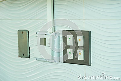 Light, electronic Switches panel on clean wall Stock Photo