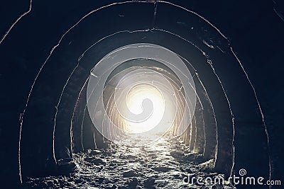 Light at the end of dark industrial tunnel, abandoned underground cave or mine, exit or escape to freedom light concept Stock Photo