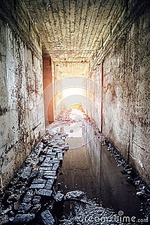 Light at the end of flooded tunnel Stock Photo