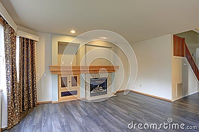 Light filled newly Updated living room interior with traditional fireplace. Stock Photo