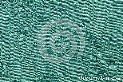 Light green pearl wavy background from a textile material. Fabric with natural texture closeup. Stock Photo