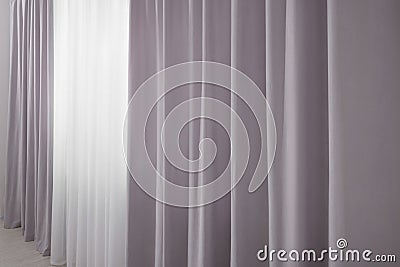 Light grey window curtains and white tulle indoors Stock Photo