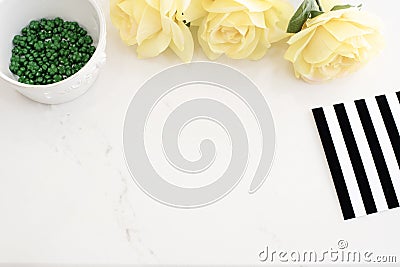 Light Marble Stylish Desktop With Yellow Roses, Black White Stripe design. Header website or Hero website, Top view . Empty place, Stock Photo