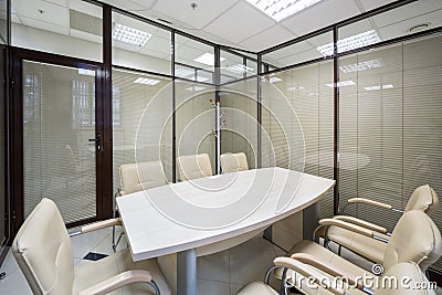 Light office blinds closed with a table Stock Photo