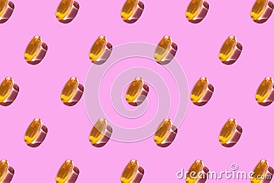 On a light pink background, a pattern of yellow omega 3 capsules. Medical summary. Wallpaper for your phone or canvas Stock Photo