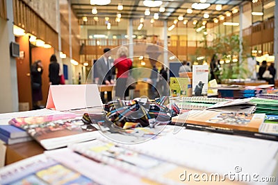 Light Pink Company Name Header Paper Tag on Exhibition Desk Stock Photo