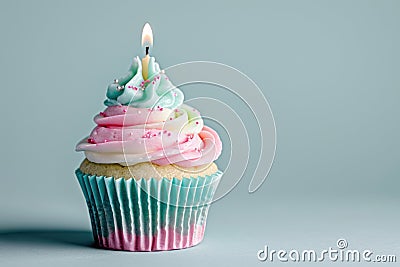 Light pink and light blue cupcake with one candle Stock Photo