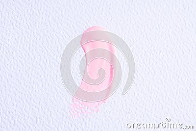 Light pink paint swatch on white paper background. Pink swatch of lip gloss, cosmetic product stroke gouache, oil paint texture, Stock Photo