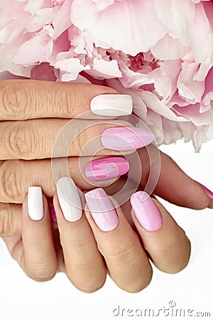 Light pink, pastel manicure on various shapes of nails Stock Photo