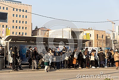 Light Rail tram (train) stop with locals and tourists Editorial Stock Photo