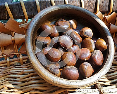 Light in roasted Chestnut in wooden bowl Stock Photo