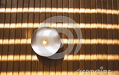 Light round candle on wooden background Stock Photo