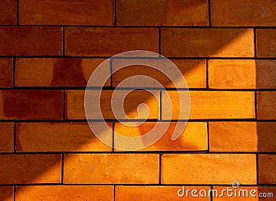 LiDetails of a lght and shadow on the red brick wall texture background. Stock Photo