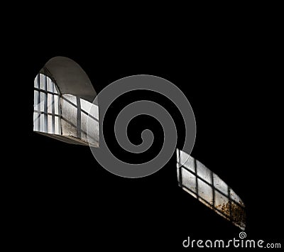 Light shining through barred window Stock Photo