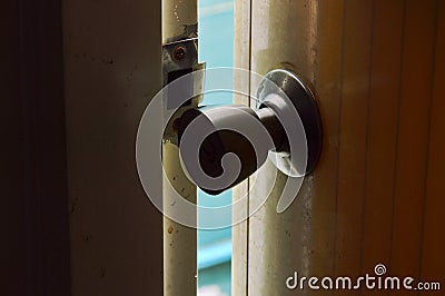 Light sift out from door ajar out in night Stock Photo