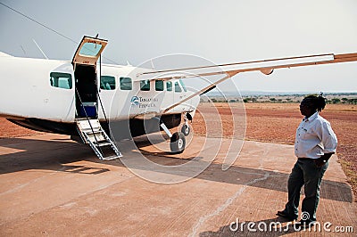 Light single engine Cessna plane at airstrip in Serengeti Grumeti Reserve - Tanzania Editorial Stock Photo