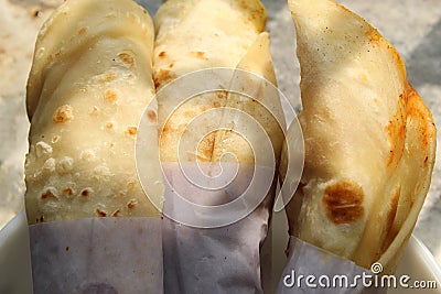 Light snack and tasty popular fast food `Egg Roll` close and cropped view. Stock Photo