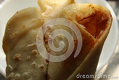 Light snack and tasty popular fast food `Egg Roll` close and cropped view. Stock Photo