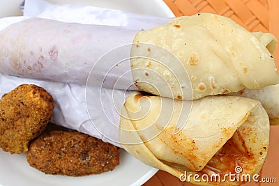 Light snack and tasty popular fast food `Egg Roll` close and cropped view. Stock Photo