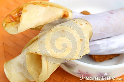 Light snack and tasty popular fast food `Egg Roll` close and cropped view. Stock Photo