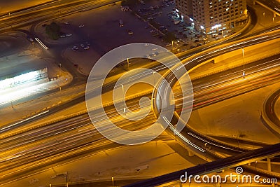 Light streaks on freeways in downtown Dubai UAE at night Stock Photo