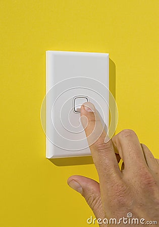 Light Switch Being Pushed Stock Photo