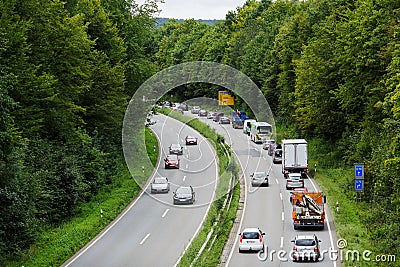 A light traffic jam with rows of cars. Traffic on the highway. Editorial Stock Photo