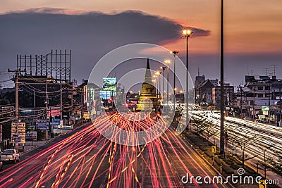 Light traffic on the road at night around the Pagoda Editorial Stock Photo