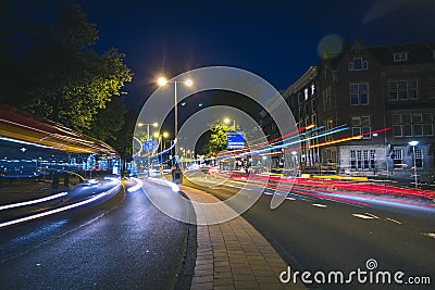 Light trails of buses and traffic in Amsterdam, Netherlands Stock Photo