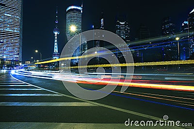 Light trails on modern building background in shanghai china Stock Photo