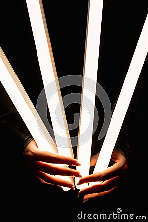 light tube led illumination hands fluorescent lamp Stock Photo