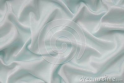 Light turquoise satin material, blue sateen fabric, silk textil Stock Photo