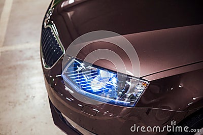 Light up blue bi-xenon led frontlight on new luxury limousine Stock Photo