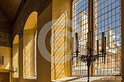 Light through window bars in medieval castle Stock Photo