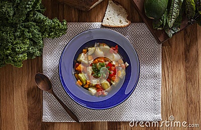 Light winter vegetable soup in blue bowl Stock Photo